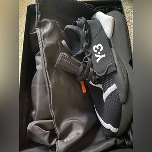 Y3 shoes with packaging intact and shoe covers